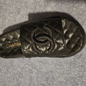 CHANEL Black Sandals with Quilted Design and Slip-On Style